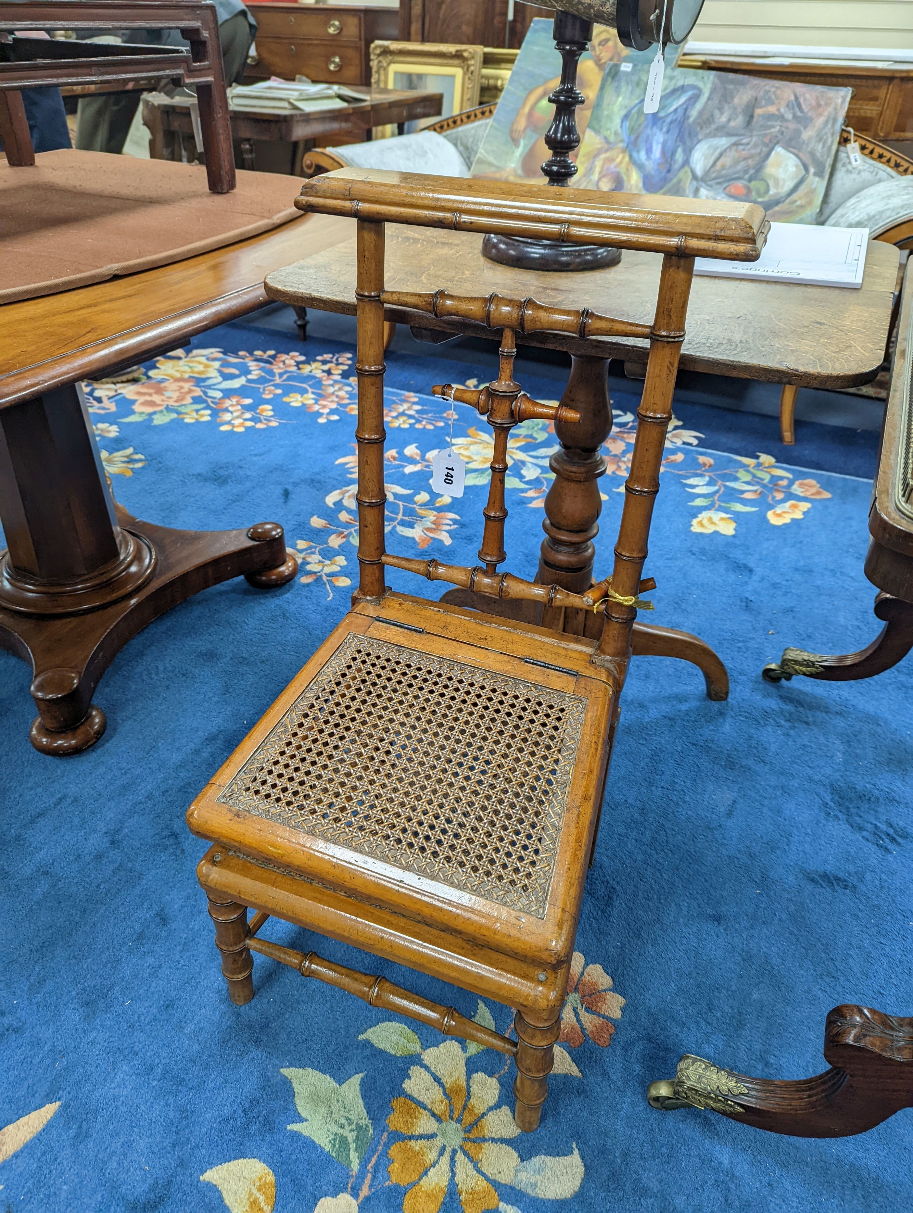 A 19th century Continental faux bamboo caned prie dieu chair